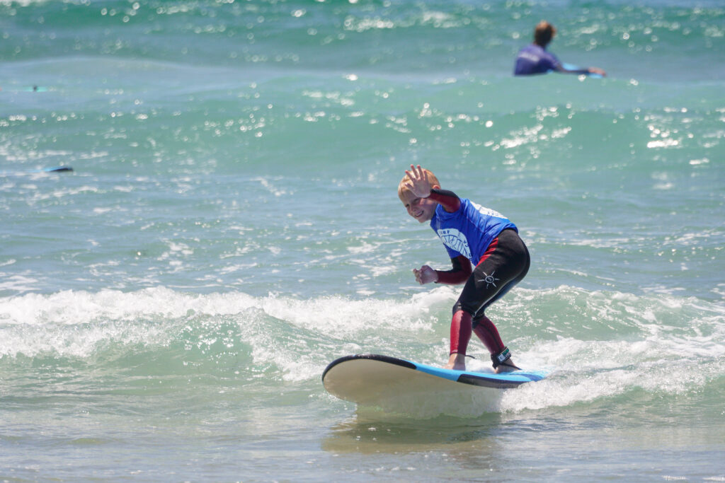 Kid having a surf lesson